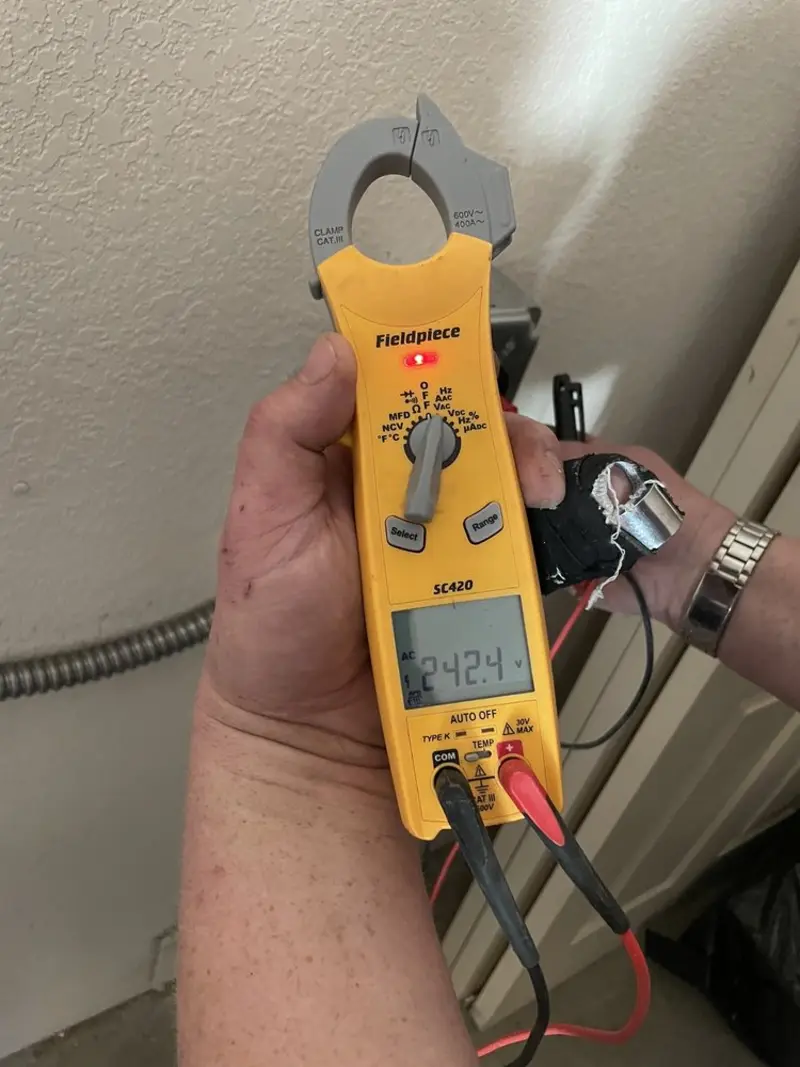 Voltage testing with clamp meter during Generator Installation in Los Angeles